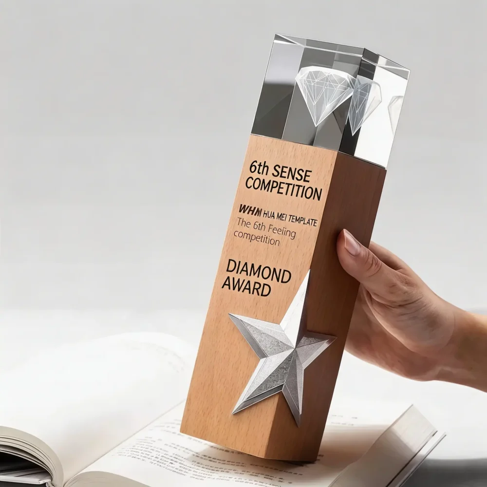 Custom diamond crystal wood trophy held in hand over open book, wholesale personalized competition award with silver star for ceremony and bulk corporate orders